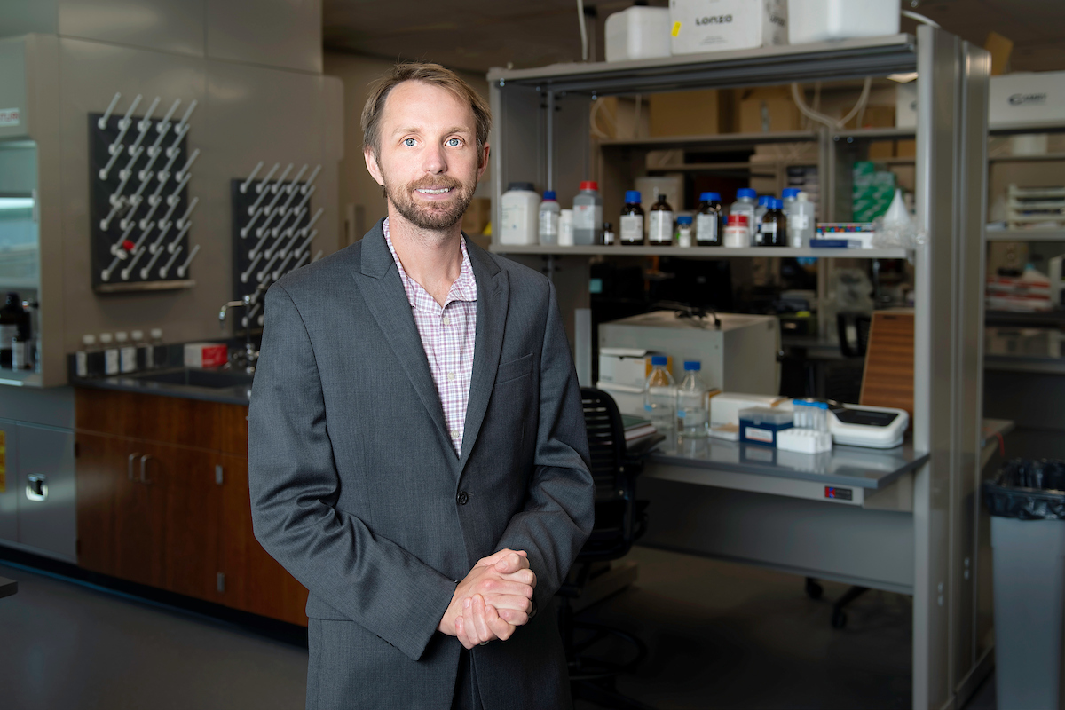 Assistant professor Brian Meckes in the lab