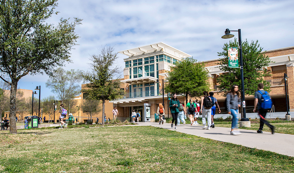 Students walk past the UNT Union