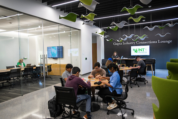 Students working in the Gupta Industry Connections Lounge at UNT Frisco