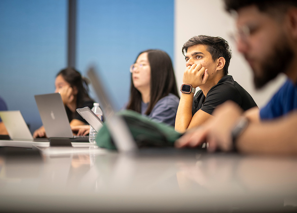Students listen to a lecture in a Frisco classroom