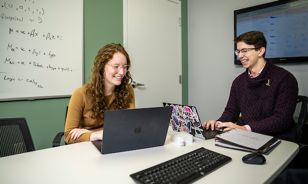 Two students work on a linguistics project