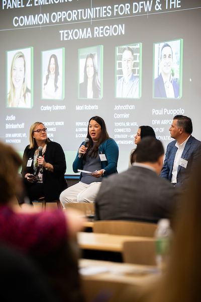 Panelists speak in front of an audience at the NSF Supply Chain Innovation and National Security Summit.