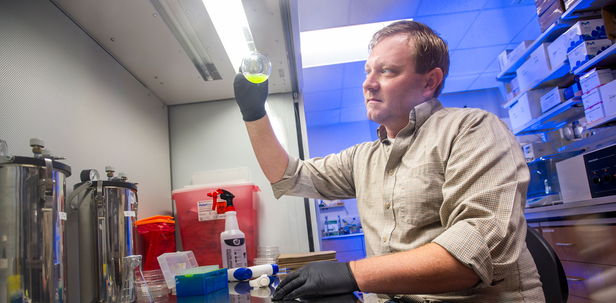 Calvin Hernard mixing things in a lab