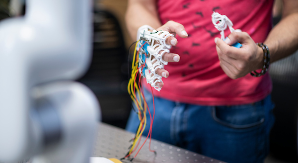 A student works with an biomedical engineering glove project