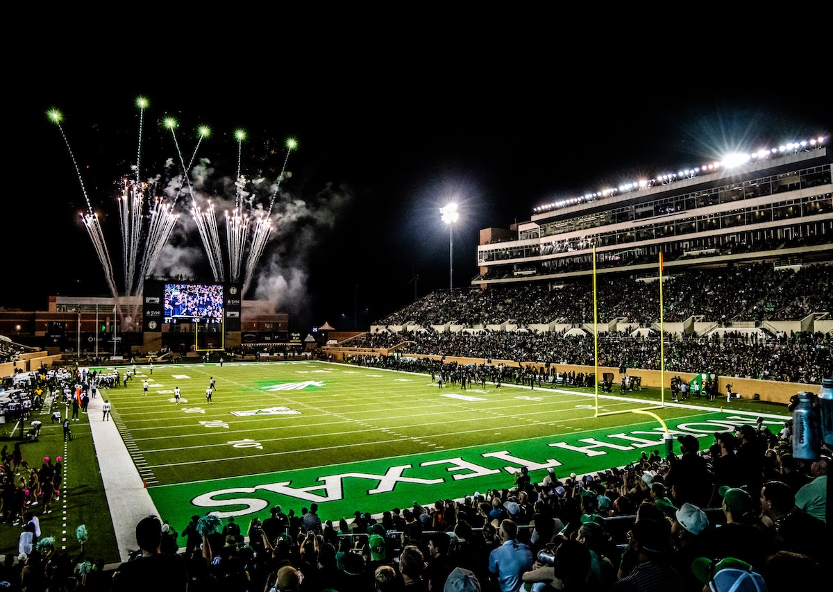 Fireworks go off at a football game in a packed DATCU Stadium